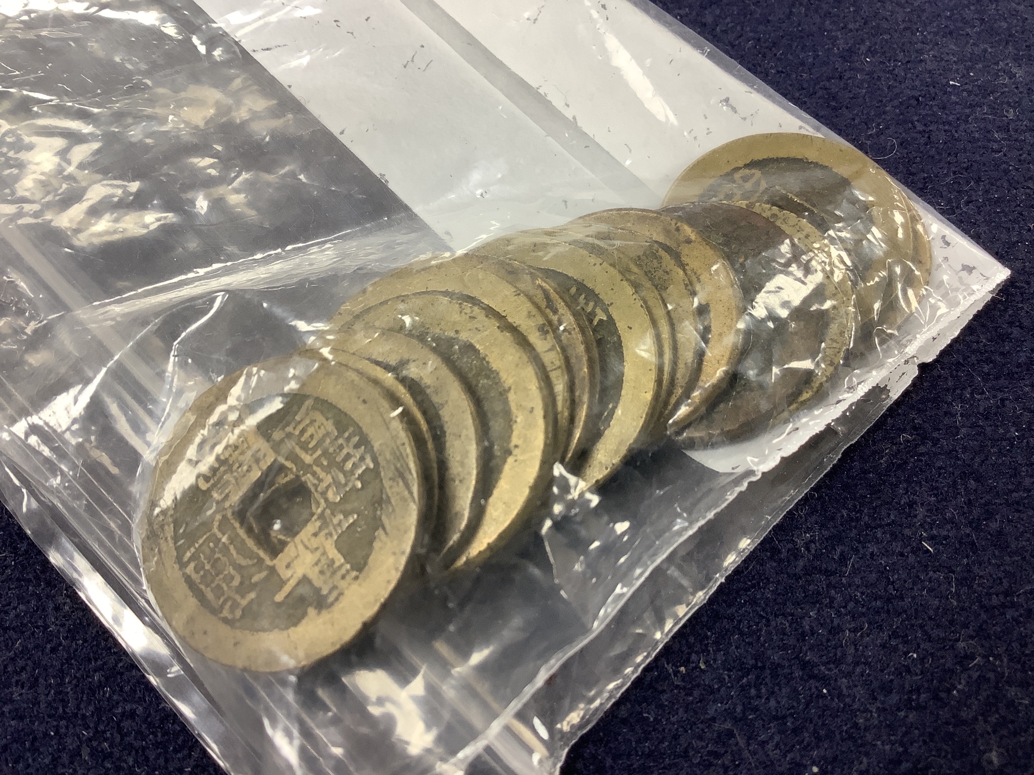 A collection of Chinese coins, stamps and two Japanese banknotes